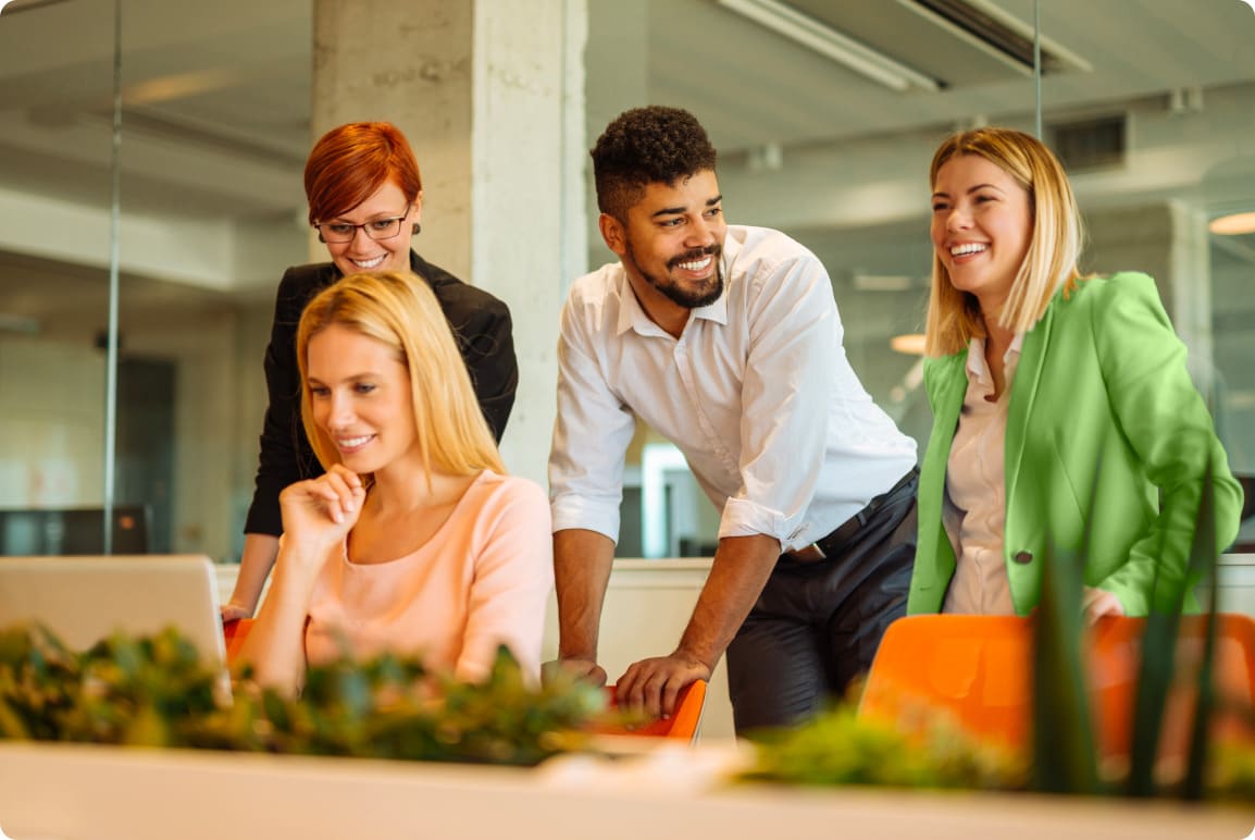 4-happy-people-behind-desk.62a5a8a5